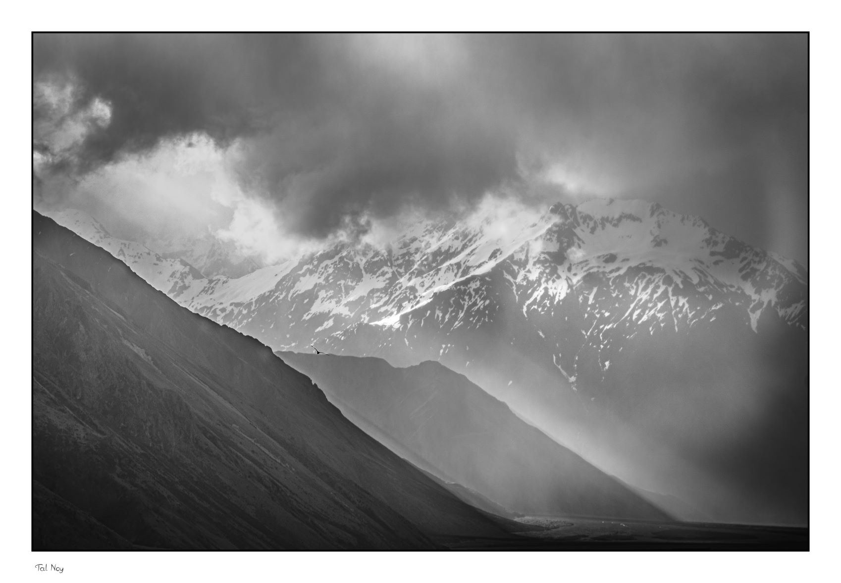 Light Rays - beams of sunlight piercing through mountain clouds